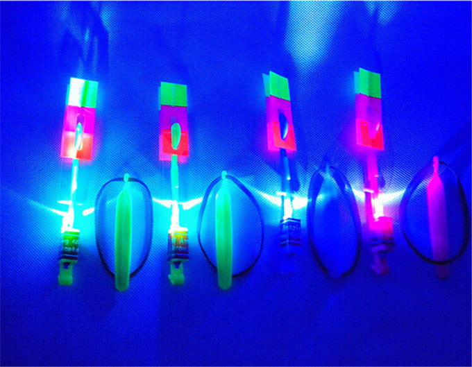 Hot sale 12Pcs Amazing LED Light Arrow Rocket Helicopter Flying Toy LED Light Flash Toys baby Toys Party Fun Gift Xmas